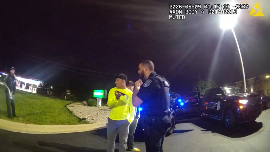 This body camera footage shows a nighttime police encounter in a parking lot.