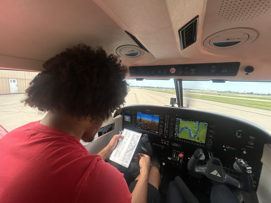 Stokes goes through his flight checklist while turning on the plane's engine.