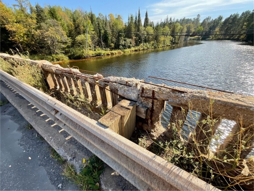 Part of the concrete railing on the M-69 bridge over the Michigamme River in Iron County.