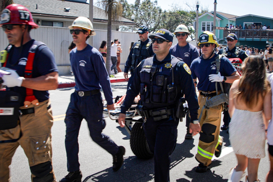 First responders with a patient at Deltopia in Isla Vista in 2024.