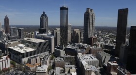 New York-based writer Reniqua Allen is noticing a new trend among black millennials — they’re moving south. Pictured: The Atlanta skyline in 2014. (Mike Stewart/AP)