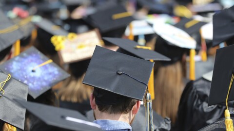 In this May 5, 2018, file photo, students attend the University of Toledo commencement ceremony in Toledo, Ohio.