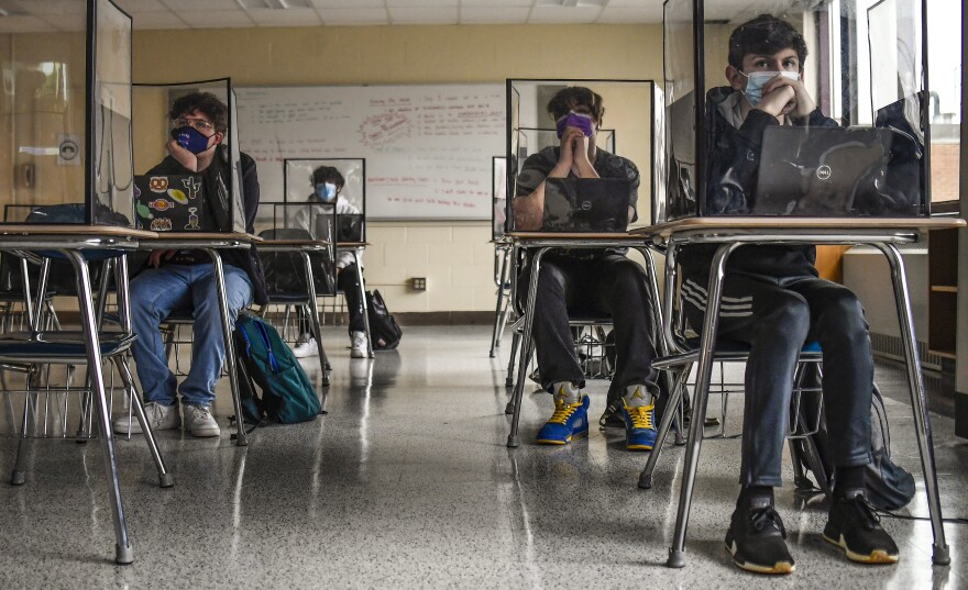 FILE - Students listen to a presentation in Health class at Windsor Locks High School in Windsor Locks, Conn in 2021. The state is still struggling to recover from chronic absenteeism brought on by the pandemic. 
