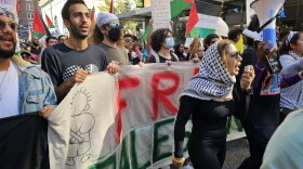  Rasha Mubarak, an organizer with the Florida Palestine Network, leads a march of several hundred Palestine supporters through the heart of Downtown Orlando. 