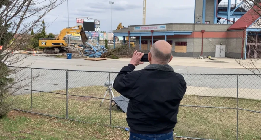 Steve Healy takes a picture of the demolition of McCoy Stadium.