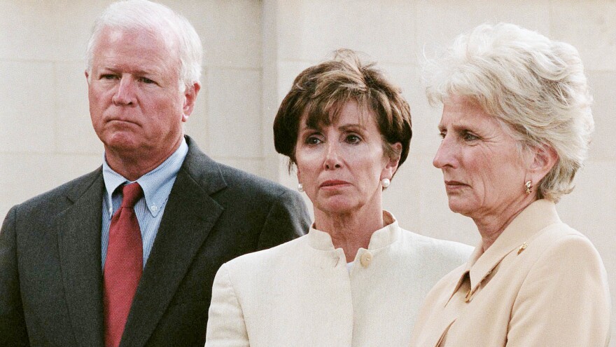 Rep. Nancy Pelosi (center), a member of House Speaker Dennis Hastert's working group on terrorism and homeland security, waits to talk to the media on Sept. 11, 2001.