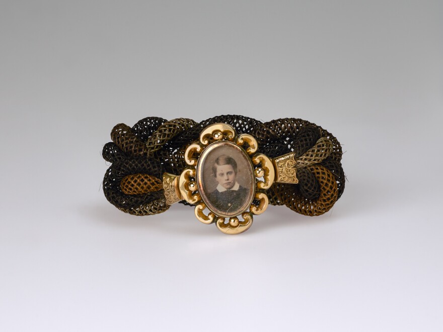 Unidentified artist, <em>Untitled (hair band, young boy)</em>, ca. 1865, daguerreotype, woven hair, metal fittings. Smithsonian American Art Museum, the L. J. West Collection of Photographic Jewelry, Museum purchase made possible through the Franz H. and Luisita L. Denghausen Endowment