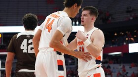 Jesse Edwards (left) and Joe Girard III (right) chat in the season opener amidst a big night from the pair.