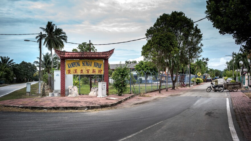 The entrance to the town of Nipah, which the Malaysian government quarantined in 1999 to try to stop the spread of a new deadly virus. "It was like a ghost town," says Thomas Wong, a former pig farmer in Nipah. "No one could come in. No one could leave."
