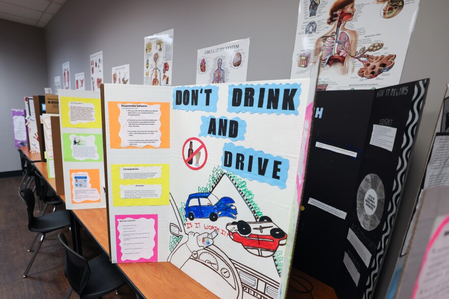 Students with the Community Health Worker certificate program created posters for a health fair at Evolution Academy Charter School in Richardson.