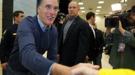 Republican presidential candidate Mitt Romney greets supporters at a caucus in Portland, Maine, on Saturday.