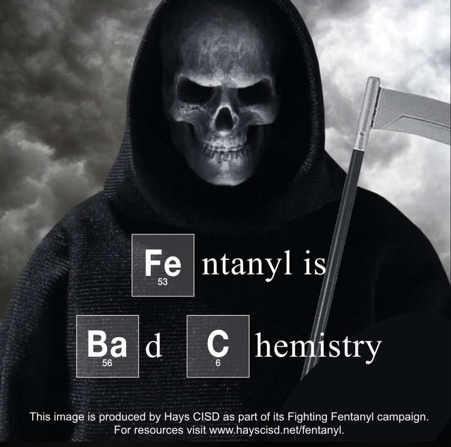 A grim reaper on a sign that says "Fentanyl is bad chemistry."