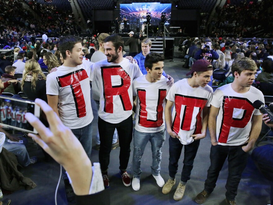 Liberty University students (from left) Austin Miller, James Ford, Jeremy Boyd, Josiah O'Boyle and Cody Hildebrand wear "TRUMP" shirts while waiting to hear the Republican presidential candidate.