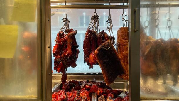Some of Kau Kau BBQ Restaurant's food hangs in the window at the restaurant in Seattle's Chinatown-International District. This time of year, the restaurant also makes turkeys for Thanksgiving, with a wildly popular following.