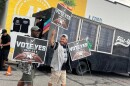 Attendees at the Spurs' Prop. A & B kickoff party in September 2025 are shown leaving at Idle Brewing leave with campaign signs.