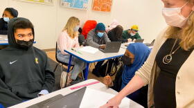 Teacher Susan Blethen supports students Kingston Kirkland and Isra Aden in this classroom in Burlington, VT.