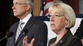 In this July 27 file photo, Sen.  Patty  Murray speaks as Senate Majority Leader Harry Reid listens at a news  conference on Capitol Hill. Reid announced earlier this month he's naming Murray to co-chair a powerful supercommittee charged  with finding more than $1 trillion in deficit cuts this fall.