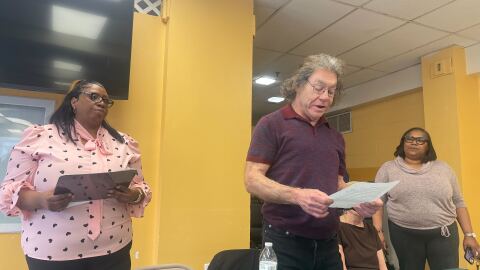 Tyra Wallace (left), Stamford Manor’s property manager, stands with Stamford Manor resident Wayne Esquivel, who has lived there for nearly eight years. Esquivel said his apartment has everything from rusty appliances to wonky floors and is in need of repairs.