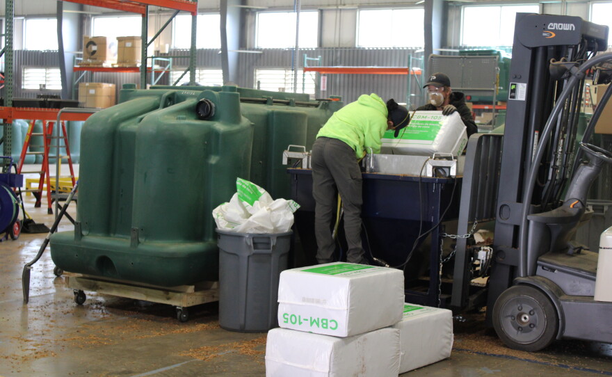 Premier Tech's employees grinding up coconut husks for their septic systems.