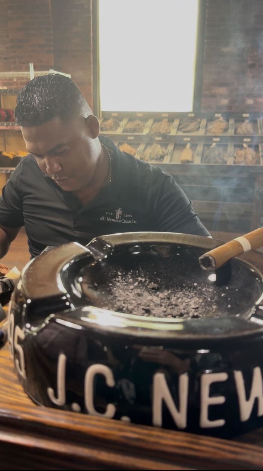 A worker hand-rolls a cigar at El Reloj, a factory operated by J.C. Newman Cigar Co. in Tampa.
