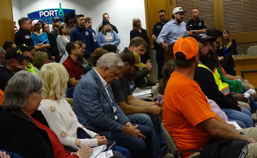 Port Washington resident and father of two Andrew Dellinger (at podium) does not think the data center will improve the lives of people who call the city home.
