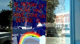 A makeshift memorial to victims of the Orlando attack hangs in the window of Spencer Pride in downtown Spencer, Indiana.