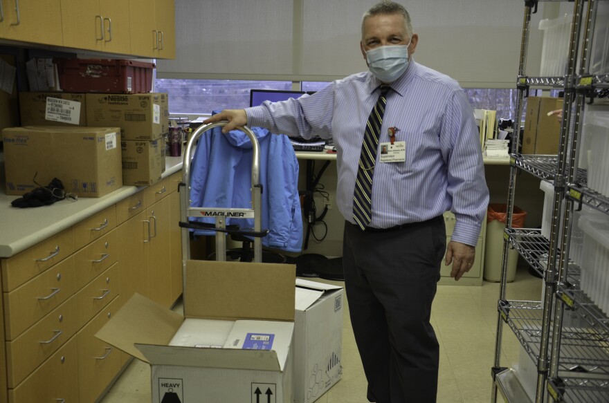 Mount Nittany Health pharmacy supervisor David Johnson receives the hospital's first shipment of COVID-19 vaccines on Dec. 16, 2020.