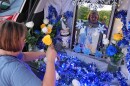 Egda Lee sets up an altar centered around a picture of the Virgin Mary which she carried with her when she crossed the U.S. border in 1984 pregnant with her son Neri Flores, as Nicaraguan parishioners of St. John Bosco Catholic Church celebrate the Dec. 8 feast of the Immaculate Conception, Sunday, Dec. 7, 2025, in Miami. (AP Photo/Rebecca Blackwell)