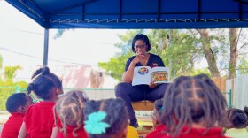 Antoinette Patterson, owner of One World Learning Center in Miami, reads to 4-year-olds on Sept. 19, 2023