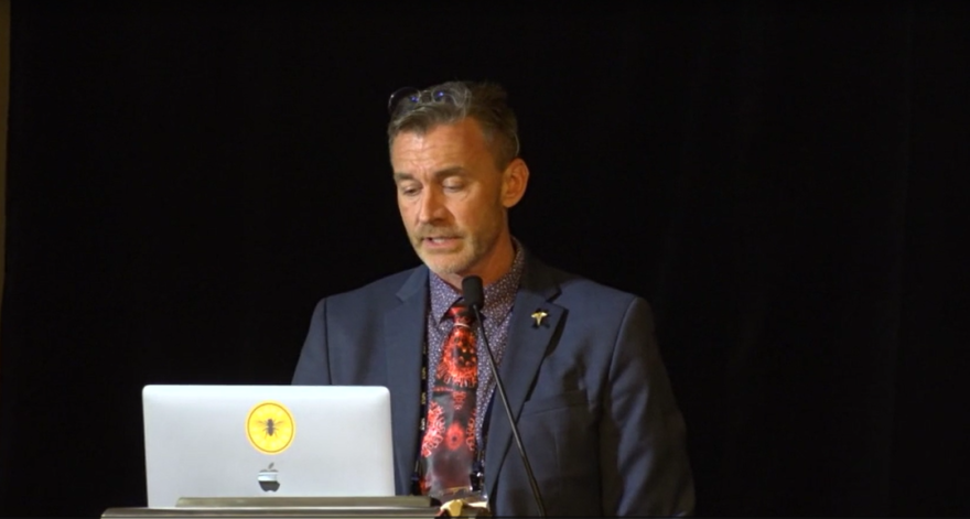 Dr. Ryan Cole speaks at a conference in early October. (Screengrab from video)
