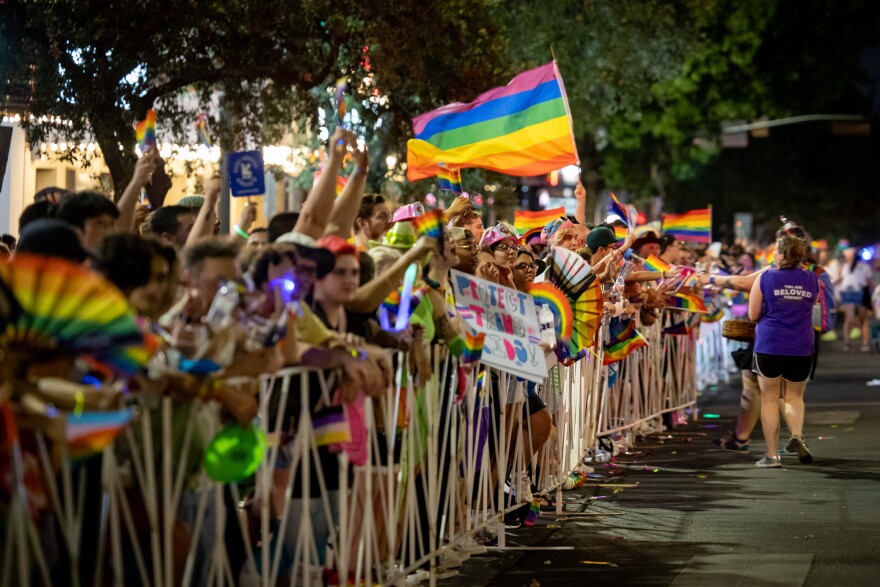 People gather in Austin for the city's yearly Pride event.