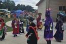 Dancers wearing Chinelos costumes.