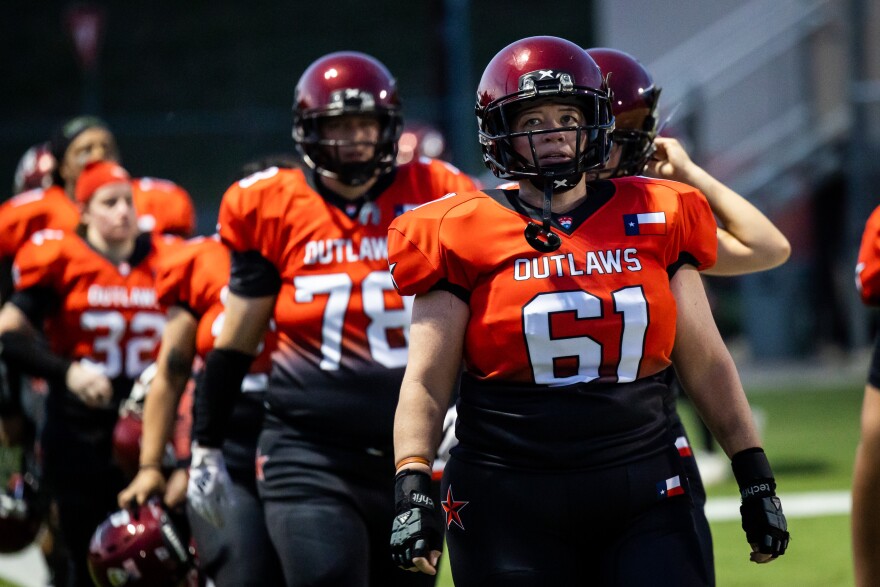 Austin Outlaws' Lily Messina (61) takes the field with teammates during the game against Arlington Impact on May 20, 2023, at House Park Stadium in Austin. Messina is also the team president. Michael Minasi / KUT