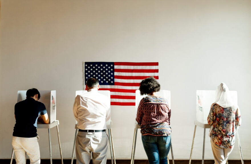 Exercising the right to vote.
