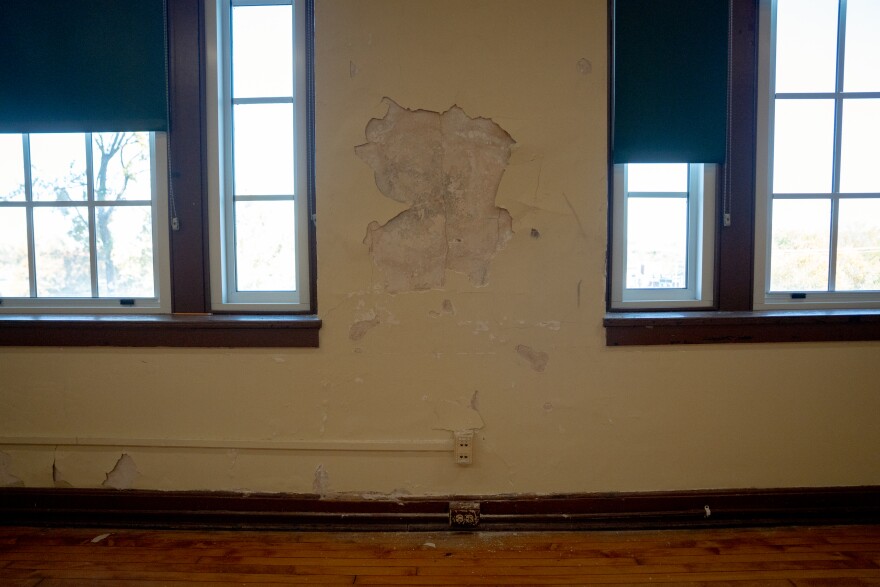 Paint and plaster are crumbling off of the wall at Sumner High School on Wednesday, Nov. 5, 2025, in north St. Louis.