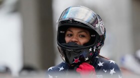 FILE - Kaysha Love of the United States celebrates after winning the women's monobob race at the Bobsleigh World Cup in Innsbruck, Austria, Saturday, Nov. 29, 2025.