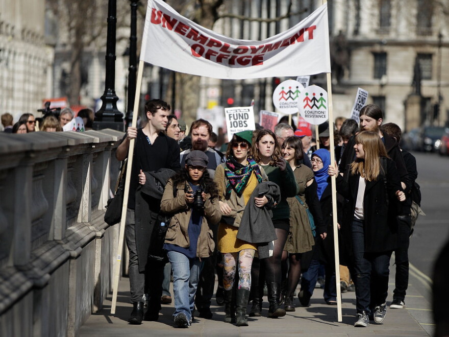 Demonstrators march from Downing Street to the Houses of Parliament to protest against austerity measures as the Chancellor of the Exchequer George Osborne prepares to leave 11 Downing Street on Budget Day March 21, 2012 in London, England. Great Britain has re-entered a recession.