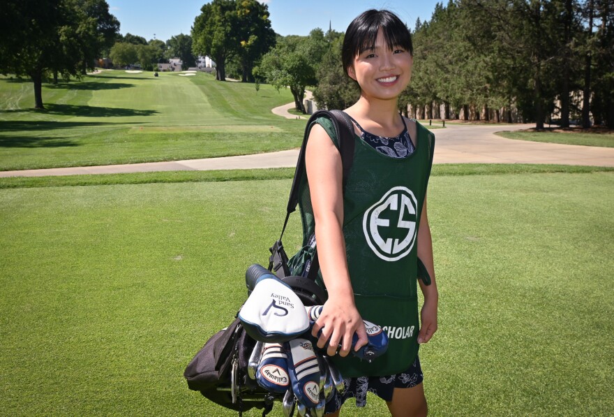 University of Kansas MBA graduate student Anh-Dao Do stands on the first tee at Indian Hills Country Club where she earned the Evans Scholar of the Year award for her caddying work.