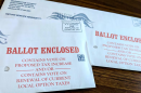 Two unopened Washington County ballots for Oregon's 2026 primary election sit on a table.