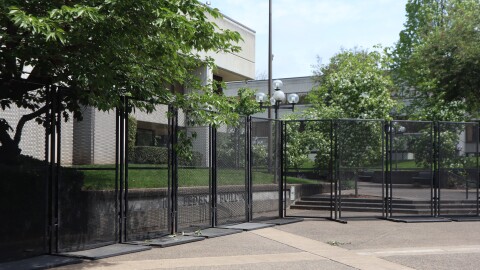 Temporary fencing, as seen in this May 1, 2026 photo, now surrounds much of the Eugene federal building, blocking off access to a courtyard where protestors gathered during a Jan. 30 protest that was declared a riot after windows were broken.