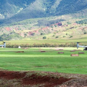 FILE - Two MV-22 Ospreys, from Marine Corps Base Hawaiʻi, land at a rally point in the Mākua Military Reservation during a joint training event on Oʻahu, Hawaiʻi, Dec. 10, 2021.