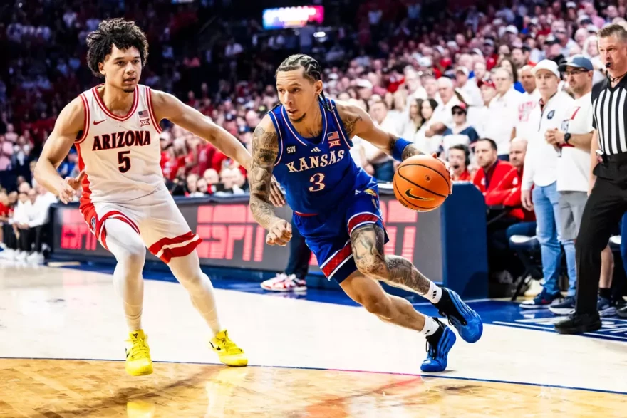 KU senior Tre White drives to the basket in a game against Arizona.