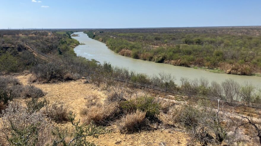 A view of the Rio Grande in Zapata County, Texas, where Customs and Border Protection plans to install cylindrical buoys. Border fencing is visible on the banks of the river.