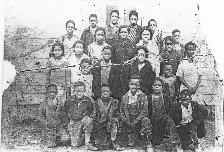 Students at African School #4 posing for a class photo outside of the one-room schoolhouse in 1931.