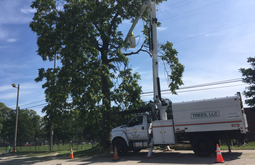 A contractor from Consumers Energy restore power in Grand Rapids.