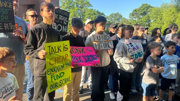 Students and educators at Oaklawn Language Academy conduct a "walk-in" to support public schools.