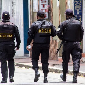 Venezuelan military walk down the street