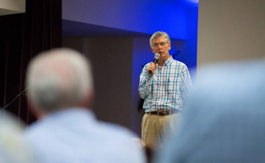 Pastor Jay Wolf leads a prayer service at First Baptist Church in Montgomery in 2019. He says he has "no idea" how many African Americans are in his congregation. "We are the body of Christ, and we need Jesus, and that's all I need to know," he says.