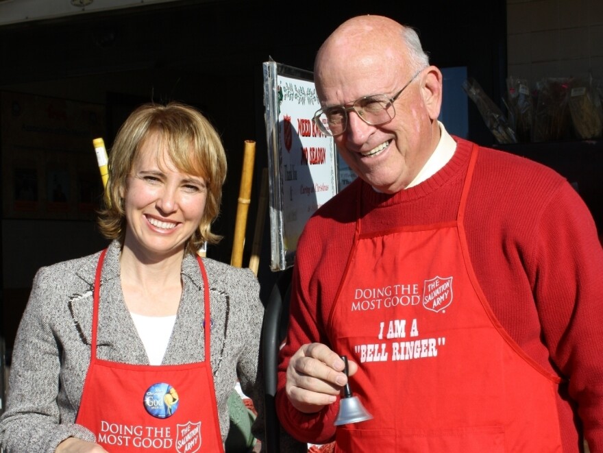Tucson Mayor Bob Walkup poses with then-U.S. Rep. Gabrielle Giffords during a Salvation Army fundraiser about a year before she was shot in the head.