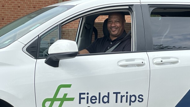Image, man driving a vehicle labeled Field Trips